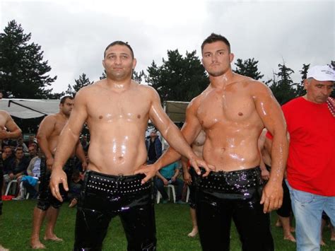 Leather-clad topless wrestlers have greased up with olive oil to take part in an annual competition in Greece . Rippling muscles on display, the half-naked competitors gathered in a makeshift ring ...